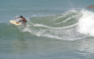 Surfer at Whiskey Point in Arugam Bay, Sri Lanka