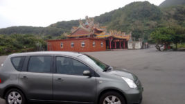 Temple in Taiwan with a NIssan Livina in front of it