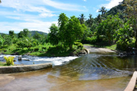 River that goes over the road Samoa Layback Travel