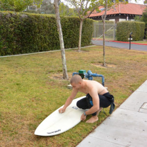 surfer board waxing surfboard surfwax wetsuit california layback travel
