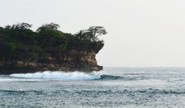 Surfer at Watu Karung - Java, Indonesia