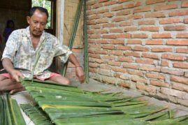 Making palm leaf roof, Sumatra, Indonesia - Layback Travel