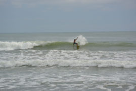 Surfer in Dominical, Costa Rica - Layback Travel