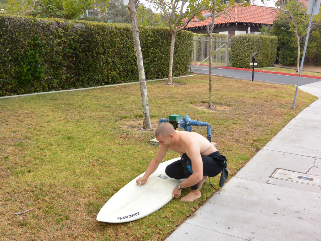 surfer board waxing surfboard surfwax wetsuit california layback travel